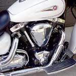 On a bike intended to house a classical rendition of the V-twin cruiser motorcycle engine, the Road Star's mildly tuned air-cooled powerplant makes a bit of sense. For 2004, Yamaha increased the bore to match the specification of the Road Star's Warrior stablemate, at 97mm, giving this Road Star engine the same total displacement of 1670cc. Yes, it's the smallest engine here, but that's not why its power lags behind the two bigger bikes we pitted it against. Simply put, the Road Star's 48-degree, air-cooled V-twin engine has very mild camshaft timing, four small valves per cylinder, and must breathe through a single 40mm carburetor. That's partly why the Road Star's engine, at 61.1 horsepower and 93.1 foot-pounds of torque, dramatically lags behind even its Warrior brother, which, thanks to fuel injection, hotter cams and a freer-breathing exhaust system, pounds out 76.3 hp and 97.9 foot-pounds of torque, and has a 1000-rpm-higher redline to boot, even though its basic engine specifications are the same as this Road Star's. Yamaha is keenly aware of the gap, and we are fairly sure the company has something afoot, either hot-rodding or a new injection of good old displacement, to remedy this situation and achieve parity. 